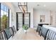 Modern dining room with a wooden table and six chairs at 160 174Th Terrace E Dr # A, Redington Shores, FL 33708