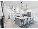 Modern kitchen featuring a large island, white cabinetry, and stainless steel appliances at 160 174Th Terrace E Dr # A, Redington Shores, FL 33708