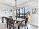 Bright dining room with large windows and a wooden table at 160 174Th Terrace E Dr # A, Redington Shores, FL 33708