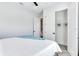 Primary bedroom with large closet and plush bedding at 160 174Th Terrace E Dr # A, Redington Shores, FL 33708