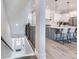 Open concept kitchen with gray island, white cabinets, and stainless steel appliances at 160 174Th Terrace E Dr # A, Redington Shores, FL 33708