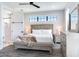 Bright bedroom with a comfortable bed and ensuite bath at 160 174Th Terrace E Dr # A, Redington Shores, FL 33708