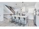 Bright and airy kitchen with a large island, white shaker cabinets, and quartz countertops at 160 174Th Terrace E Dr # A, Redington Shores, FL 33708