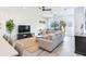 Spacious living room with comfortable seating and large windows at 160 174Th Terrace E Dr # A, Redington Shores, FL 33708