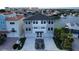 Modern three-story waterfront home with attached two-car garage at 160 174Th Terrace E Dr # A, Redington Shores, FL 33708