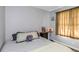 Bright bedroom with gray walls, featuring a large bed and window at 4407 W Bay Villa Ave, Tampa, FL 33611