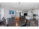 Bright dining room with a view into the kitchen and living room at 4407 W Bay Villa Ave, Tampa, FL 33611