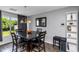 Dining area features a dark wood table with six chairs and wine cooler at 4407 W Bay Villa Ave, Tampa, FL 33611