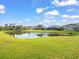 Scenic pond with lush green landscape at 6226 Desert Peace Ave, Land O Lakes, FL 34639