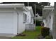 Side view of a white single story home and garage at 4166 96Th N Ter # 4166, Pinellas Park, FL 33782