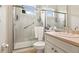 Modern bathroom featuring a walk-in shower, vanity and ample natural light at 15911 Cobble Mill Dr, Wimauma, FL 33598