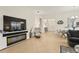 Bright and airy living room featuring tile floors and a modern fireplace at 15911 Cobble Mill Dr, Wimauma, FL 33598