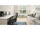 Bright home office featuring a large window and comfortable seating at 15911 Cobble Mill Dr, Wimauma, FL 33598
