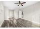 Simple bedroom with laminate wood flooring and a ceiling fan at 2145 68Th S Ave, St Petersburg, FL 33712