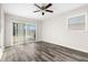 Bedroom with sliding glass doors and laminate flooring at 2145 68Th S Ave, St Petersburg, FL 33712