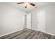 Bright bedroom with wood-look floors, ceiling fan and double door closet at 2145 68Th S Ave, St Petersburg, FL 33712
