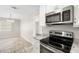 Eat-in kitchen with stainless steel appliances and granite countertops at 2145 68Th S Ave, St Petersburg, FL 33712