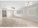 Bright living room with neutral paint, tile floors, and abundant natural light at 2145 68Th S Ave, St Petersburg, FL 33712