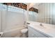 Simple bathroom with white vanity and tub shower combo at 4350 Live Oak Blvd, Palm Harbor, FL 34685