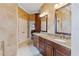 Bathroom with double vanity, granite countertop and separate tub at 8945 Magnolia Chase Cir, Tampa, FL 33647