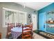 Bright dining area featuring a checkered tablecloth and wooden chairs at 509 Langford Cir, Plant City, FL 33563