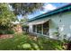 Home's side yard with landscaping and lawn at 509 Langford Cir, Plant City, FL 33563