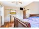 Spacious bedroom with a wooden dresser and large window at 509 Langford Cir, Plant City, FL 33563
