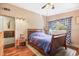 Main bedroom with double bed and hardwood floors at 509 Langford Cir, Plant City, FL 33563