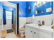 Blue bathroom with single vanity and tub shower combo at 509 Langford Cir, Plant City, FL 33563