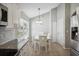 Bright dining area with white table and chairs near the kitchen at 3705 71St E Ter, Sarasota, FL 34243