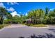 Community entrance with gate and lush landscaping at 8125 Stone Path Way, Tampa, FL 33647