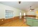Bright dining area with hardwood floors and wood paneling at 2804 Holloway Rd, Plant City, FL 33567