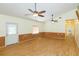 Spacious living room with hardwood floors and ceiling fans at 2804 Holloway Rd, Plant City, FL 33567