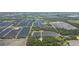 Aerial view showcasing home's location amidst farmlands and greenery at 2804 Holloway Rd, Plant City, FL 33567