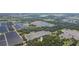 Aerial view showing home with surrounding green space and agricultural fields at 2804 Holloway Rd, Plant City, FL 33567