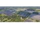 Aerial view showing home's location in a rural setting near farmlands at 2804 Holloway Rd, Plant City, FL 33567