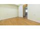 Small bedroom with wood-look floors and door to another room at 2804 Holloway Rd, Plant City, FL 33567