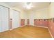 Simple bedroom with hardwood floors and double closets at 2804 Holloway Rd, Plant City, FL 33567