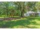 Large backyard with playset and home view at 2804 Holloway Rd, Plant City, FL 33567