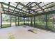Screened porch with ceiling fan and wood pergola at 2804 Holloway Rd, Plant City, FL 33567