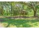 Play set in a tree-filled backyard, great for  at 2804 Holloway Rd, Plant City, FL 33567