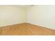 Bright bedroom with wood-look floors and an interior door at 2804 Holloway Rd, Plant City, FL 33567