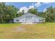 White barn with large garage door at 2804 Holloway Rd, Plant City, FL 33567