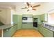 Modern kitchen with green cabinets and stainless steel appliances at 2804 Holloway Rd, Plant City, FL 33567
