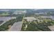 Aerial view showing home surrounded by lush trees and agricultural land at 2804 Holloway Rd, Plant City, FL 33567
