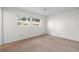 Simple bedroom with carpet flooring and large windows at 2465 Northside Dr # 701, Clearwater, FL 33761