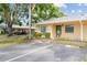 Tan single story home with green shutters and parking at 2465 Northside Dr # 701, Clearwater, FL 33761