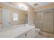 Clean bathroom with shower and floral wallpaper at 2465 Northside Dr # 701, Clearwater, FL 33761