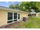 Back exterior view showing a yellow house with AC unit at 2465 Northside Dr # 701, Clearwater, FL 33761