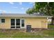 Back exterior view of a yellow house with AC unit at 2465 Northside Dr # 701, Clearwater, FL 33761